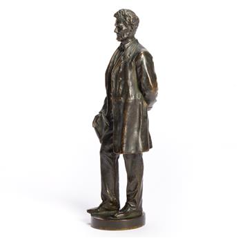 (ABRAHAM LINCOLN.) George E. Bissell, sculptor. Statuette of Lincoln standing with the Emancipation Proclamation.